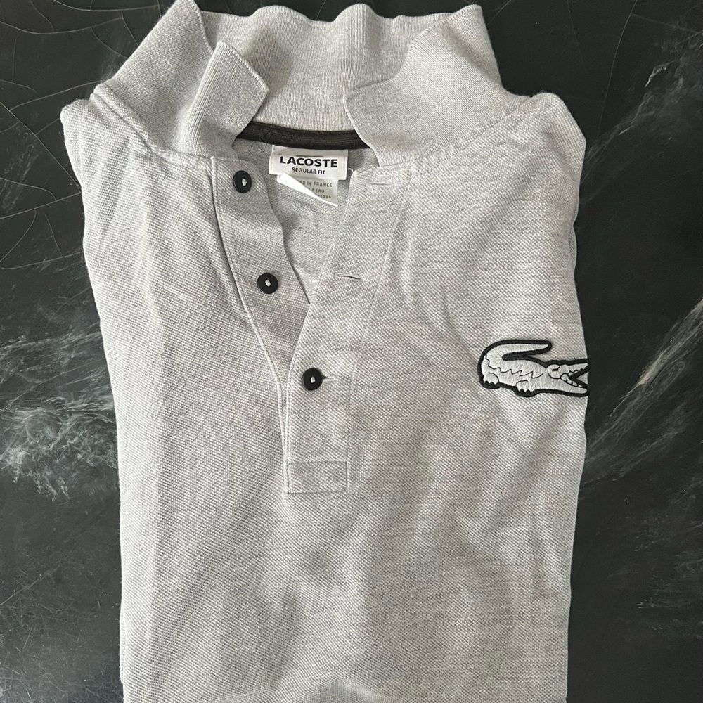 LACOSTE men’s regular fit polo shirt size L. Gray and black.